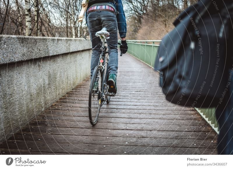 Passing cyclist from behind on a narrow bridge cyclists Bicycle Cycling Bicycle tyre standing Transport Means of transport Traffic infrastructure Mobility