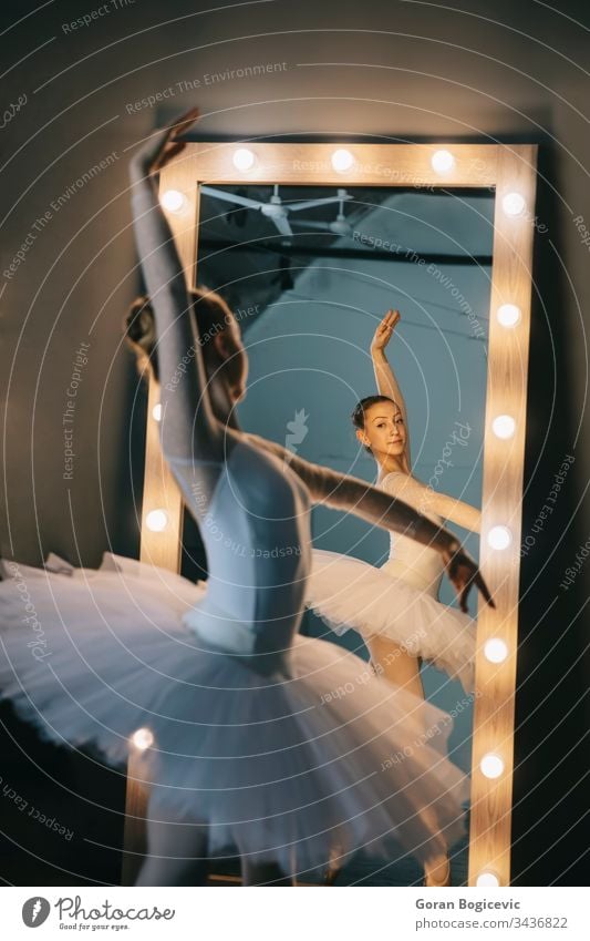 Elegant ballerina in white dress dancing in studio action adult attractive background balance ballet body choreography classic classical dance dancer elegance