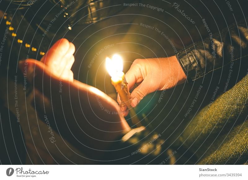 Woman holding a candle at night, during the Easter celebrations easter church candles orthodox religion christian light people prayer fire dark flame woman