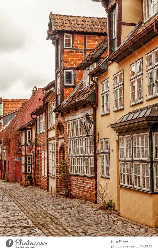 Street in Lüneburg old town Luneburg Germany Lower Saxony Old town houses Cobblestones Historic