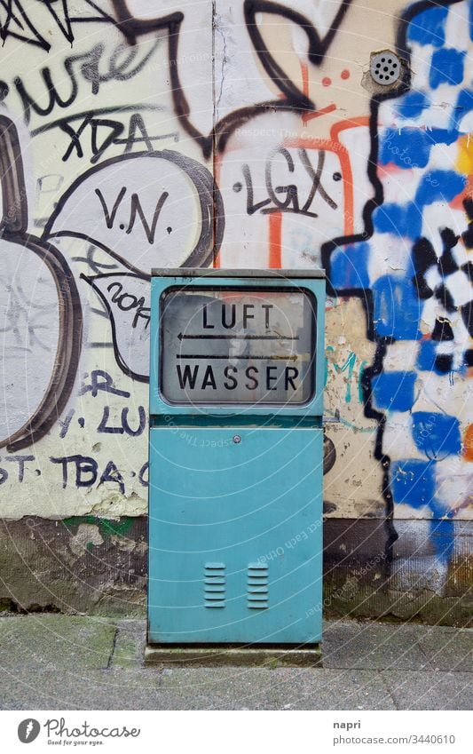 nothing more is needed | Old service station for air and water in front of the wall with colorful graffiti. Self-service Air Water Workshop urban Recharge