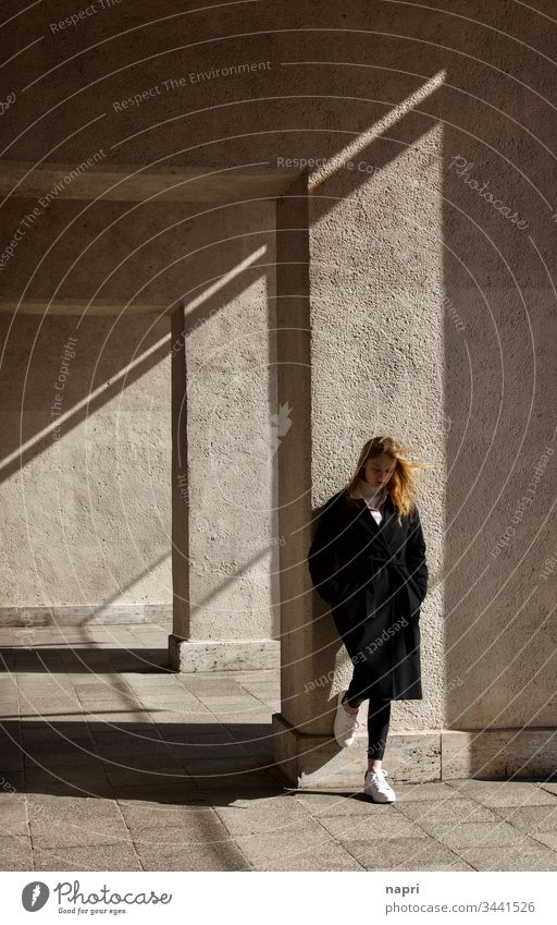 Lost in transition. | Young woman stands thoughtfully leaning against a wall. Youth (Young adults) 18 - 30 years Meditative brood on one's own Think Loneliness