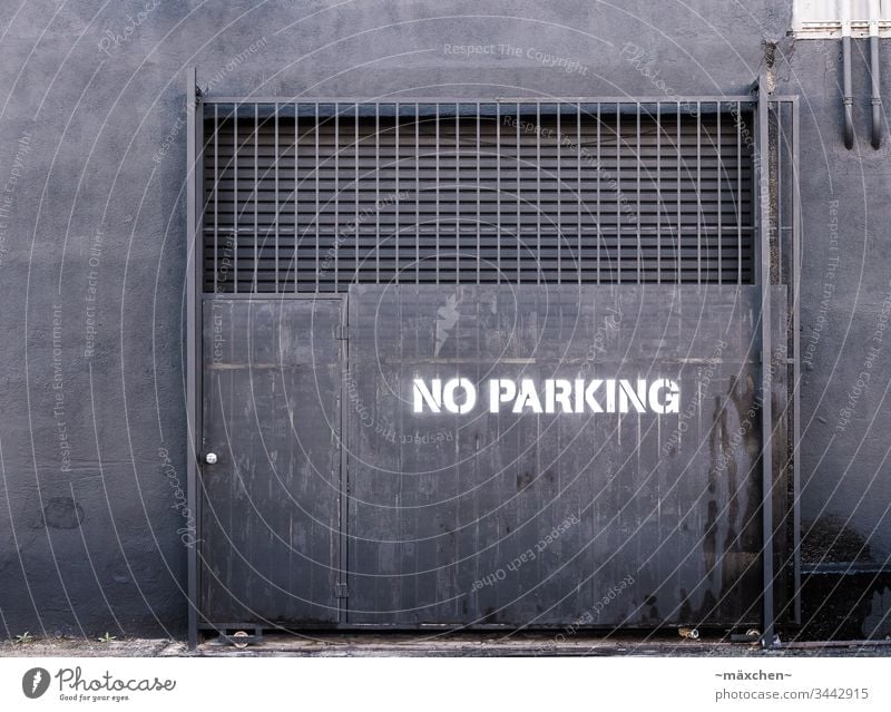 No parking Los Angeles Street Gray Black Anthracite no parking White Sprayed Goal Wall (barrier) conduit Grating Protection Door on the outside somber Town