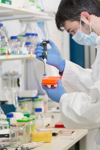 man pipetting in the laboratory dropper pipette analysis analyzing biological biotechnology care chemical chemist chemistry clinic corona coronavirus