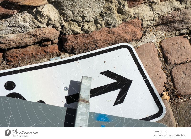 Signs | away with it sign Road sign filed Signs and labeling reclining Pictogram Ground Paving stone Wall (barrier) Sandstone Deserted Light Shadow out of order