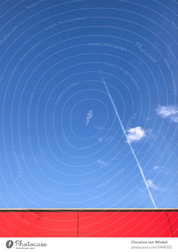 blue sky with few clouds, an airplane with contrails and red facade Blue sky Clouds Sky Beautiful weather Airplane Freedom Aviation Vapor trail Building facade