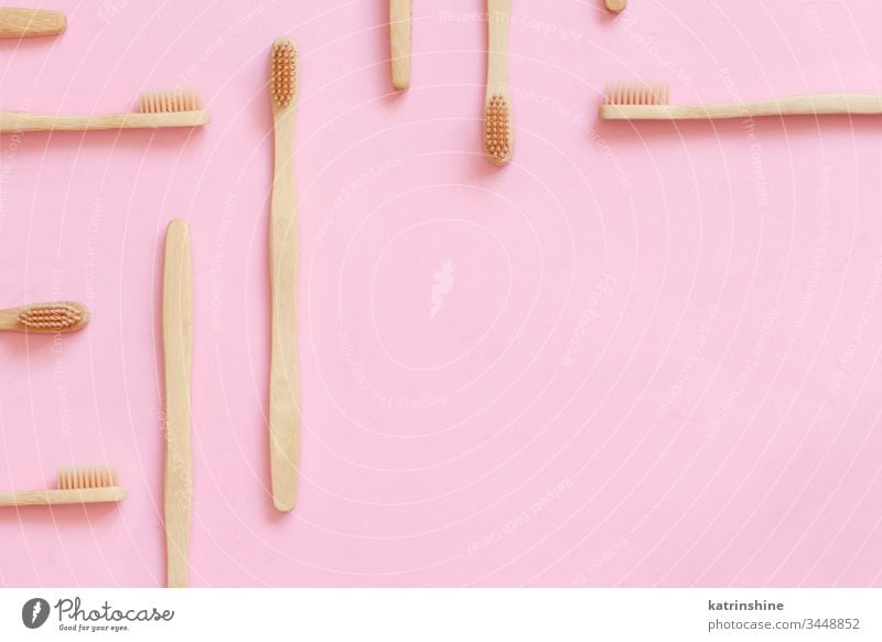Eco friendly bamboo toothbrushes on pink background waste concept copy space light pink top view zero waste tooth brushes eco health alternative cleaning above