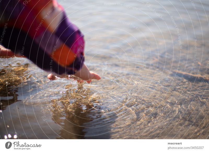 Child plays with water Girl Water Waves Hand Discover curious inquisitorial Playful Study Cold cold Spring Body of water Infancy untroubled Easy feel Fingers