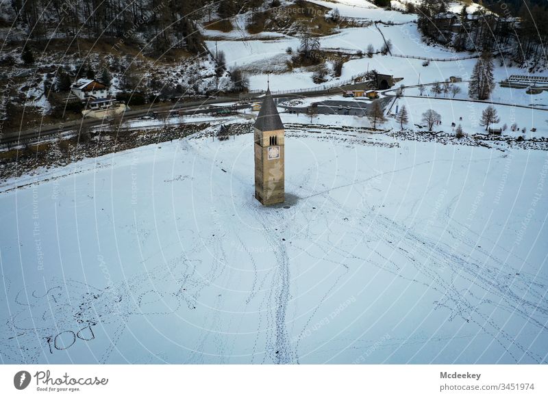 church tower frozen lake Ice Ice-skating Lake Frozen Frozen water Kite Skiing Cold reschenpass Drone drone flight drone view Drone pictures Winter landscape