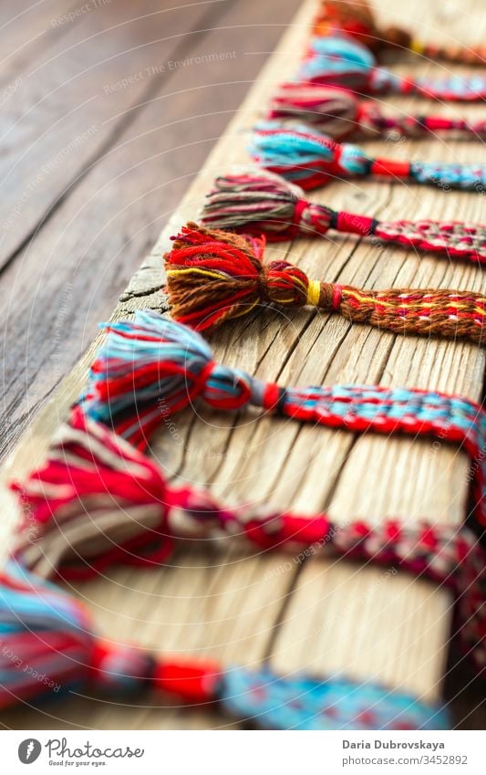 woven belts from colored threads in ethnic style colorful culture background textile texture natural handmade design white craft folk pattern retro nature