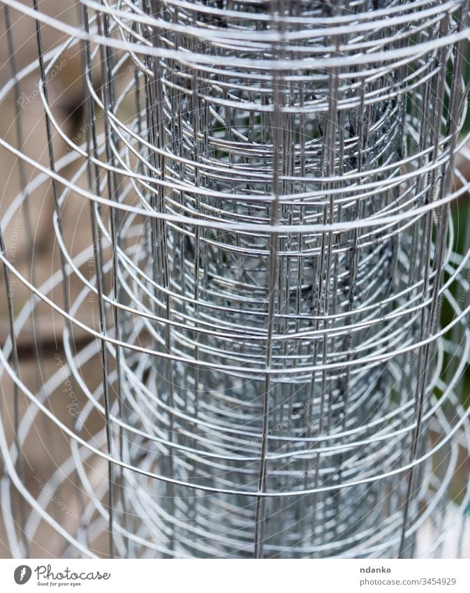 twisted metal fence made of wire abstract barbed barbwire barrier border cage closeup construction defense design element gray grid guard industry iron link
