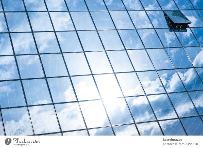 Modern facade of glass and steel. background sky cloud skyscraper abstract economy architecture real estate blue commercial office construction exterior city