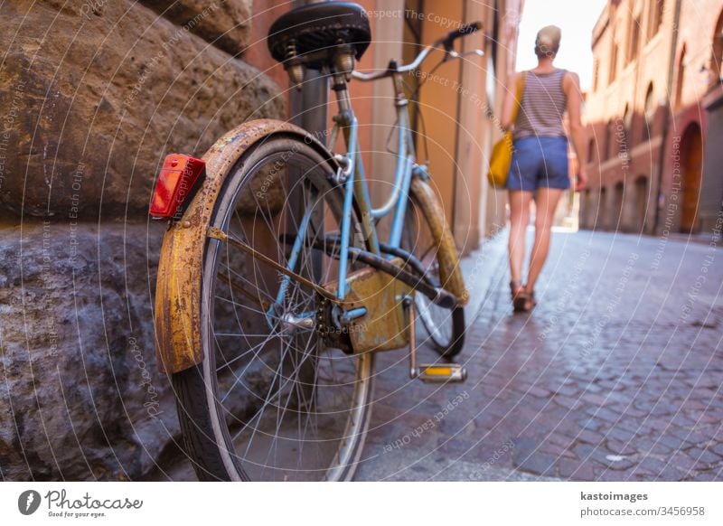 Retro bycicle on old Italian street. bike travel woman lady european town walk building stone architecture vintage sidewalk retro transport behind city bicycle