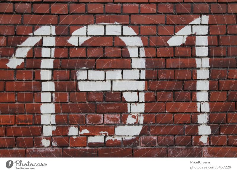 Graffiti on brick wall Architecture Wall (barrier) Facade House (Residential Structure) Characters Building Colour photo Brick wall, numbers