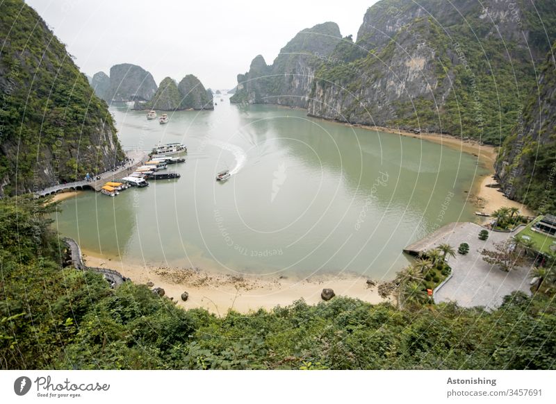 Boats in a book in Ha-Long Bay, Vietnam distance wide Waves Asia Halong Exterior shot Vacation & Travel Halong bay Rock Stone Nature Ocean Landscape