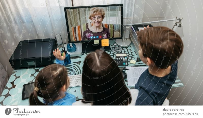 Family talking on video call with grandmother top view family video conference computer coronavirus panorama quarantine covid-19 woman kid child grandma aerial