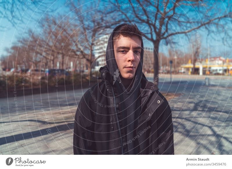 portrait of a serious young man with hoodie lifestyle adolescent adult attractive beautiful beauty boy casual caucasian closeup confidence confident cool