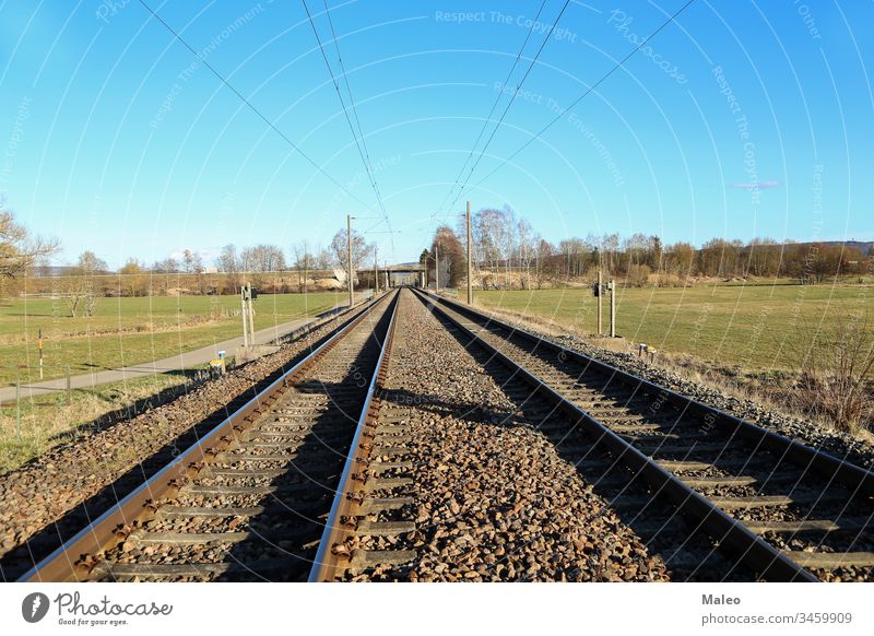 Railway stretching into the distance of fields rail railroad railway travel landscape nature outdoor transportation green track country countryside iron journey
