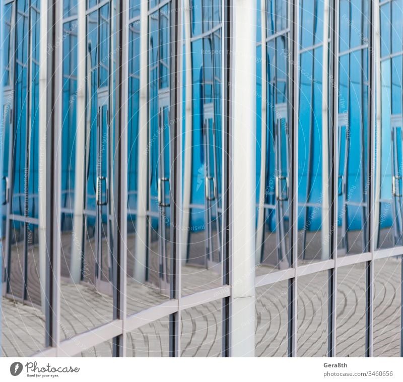 abstract background reflected in the glass windows of the building architectural architecture blue city clean clean window distortion door empty empty window