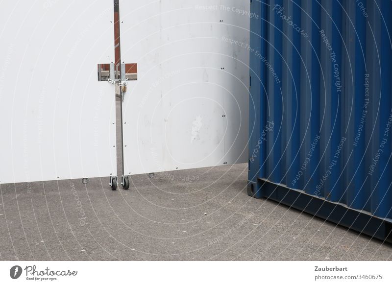 Colour surfaces white, grey and blue from mobile wall with castors, container and concrete White Blue Gray Wall (building) cordon Container Asphalt Street Lock