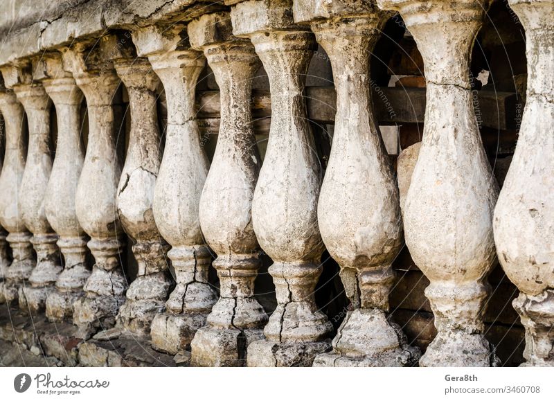 row of antique small columns ancient antique columns architecture cracked cunning decor identical old retro rough row of columns several shabby vintage wall