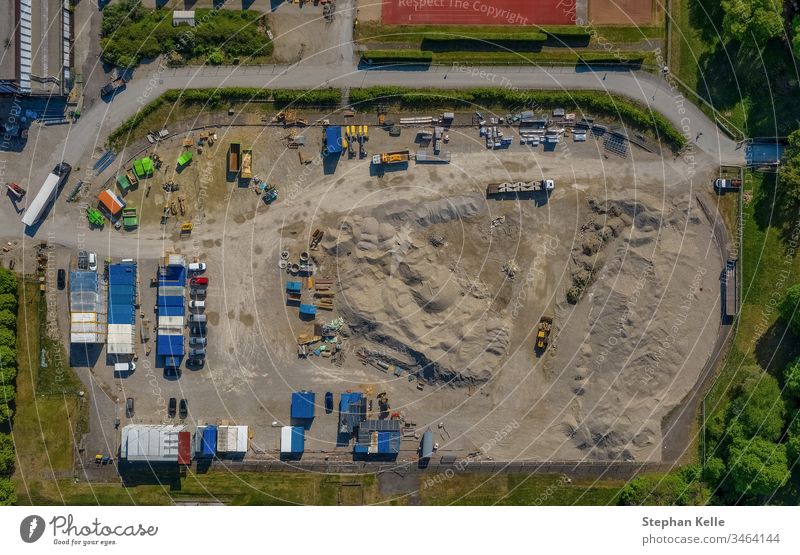 Construction area from top view of a drone construction aera work container sand earth build up transport drive new high aerial dirt built upfrom above copter