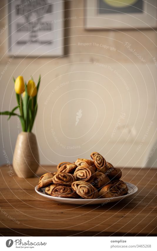 Korvapuusti - Finnish cinnamon buns on a plate biscuits Baking tray Delicious back open Tin Sugar Baker at home baking paper Tradition Cinnamon Cardamom Plate