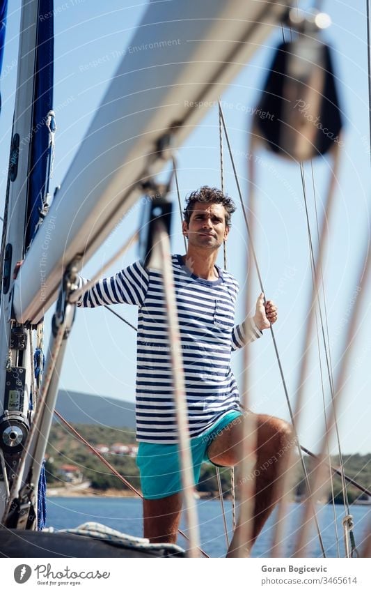 Young man on a sailboat white beauty nature health sea transportation summer travel mediterranean water lifestyle portrait light tourism young alone cruise ship