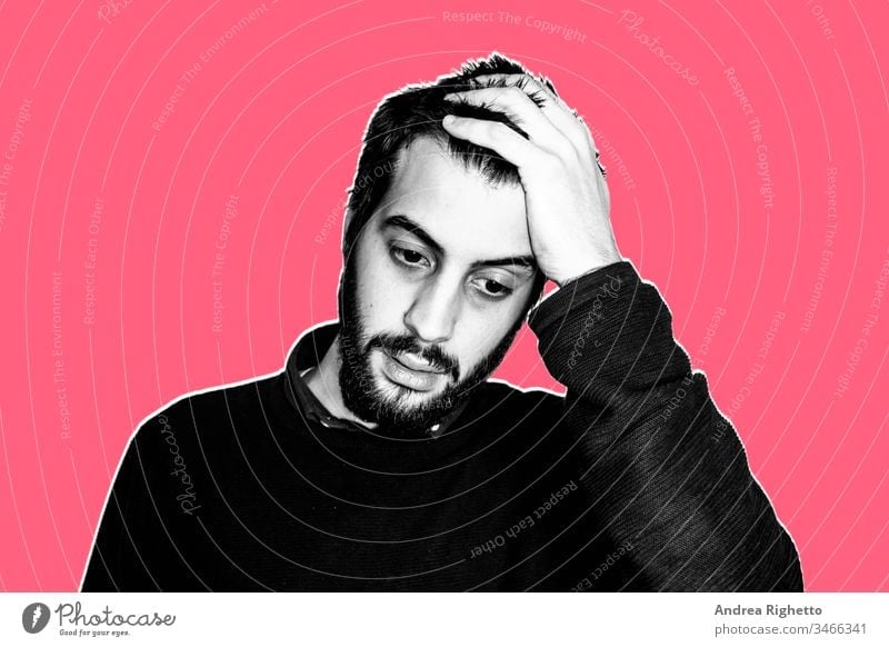 Contemporary art collage. Concept of impossible, unmanageable. Portrait of a young bearded man with his hand in the head. He's hopeless. He thinks he can't do it. Black and white image. Red background