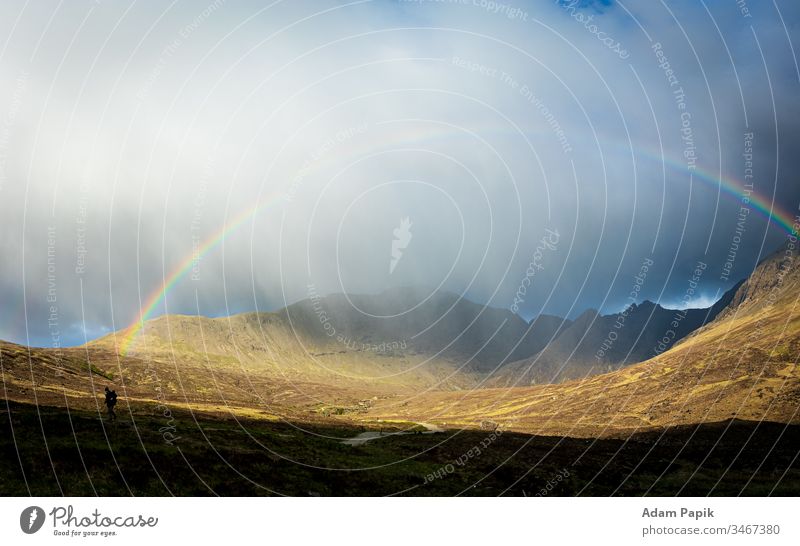 Rainbow over the Scottish highlands with a man. rainbow mountains fog mist sky landscape hiking scotland isleofskye Nature Hiking Exterior shot Colour photo