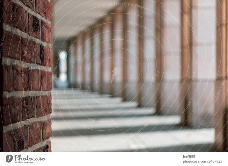 View into the arcades of the city Arcade Architecture Column Building Symmetry Facade Structures and shapes Elegant Vanishing point Old town brick red brick