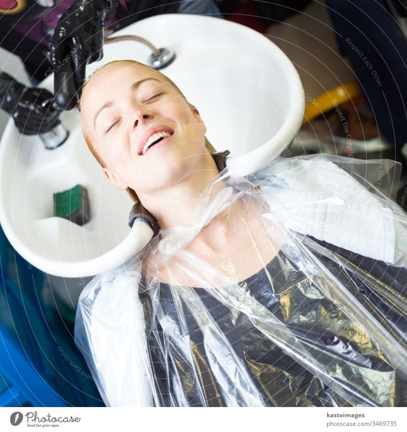 Hairdresser salon. Woman during hair wash. hairdresser woman beauty wet hands hairstyle female long conditioner girl haircut beautiful pretty face stylist
