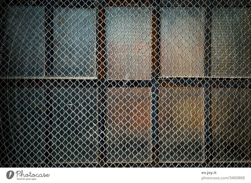 latticed window of an old factory building Window Grating locked Pane frowzy Old Factory Safety Protection Closed Colour photo Window transom and mullion