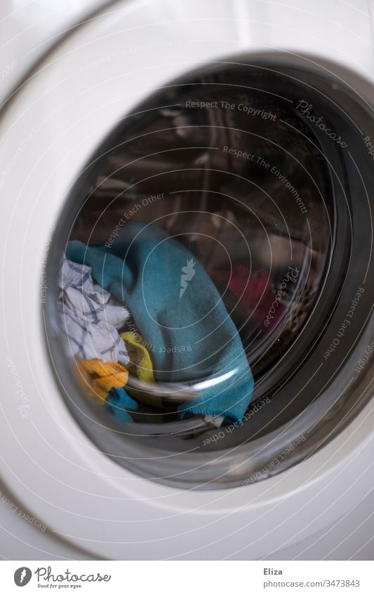 Coloured laundry in the washing machine with washable and reusable cloths; sustainable and environmentally friendly Washer Reusable rag Sustainability