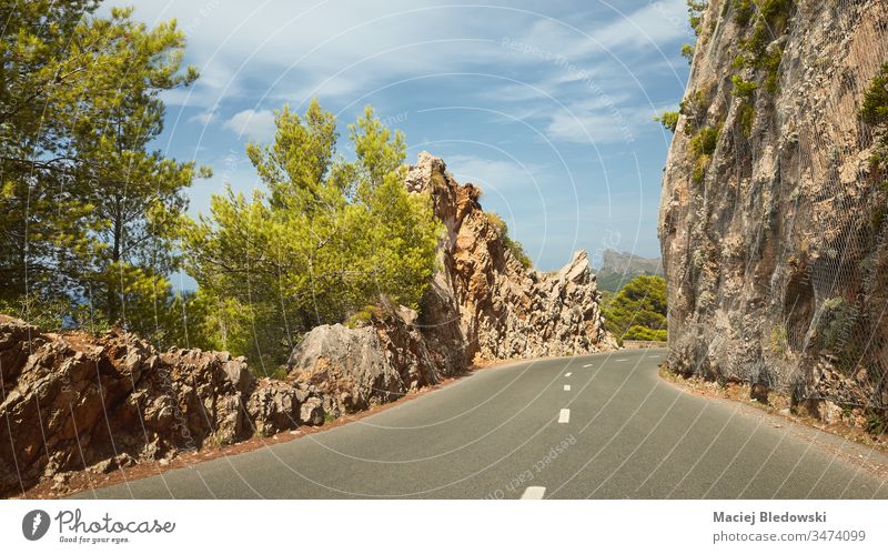 Scenic mountain road on Mallorca coast, Spain drive trip journey summer holiday rock empty nature landscape scenic