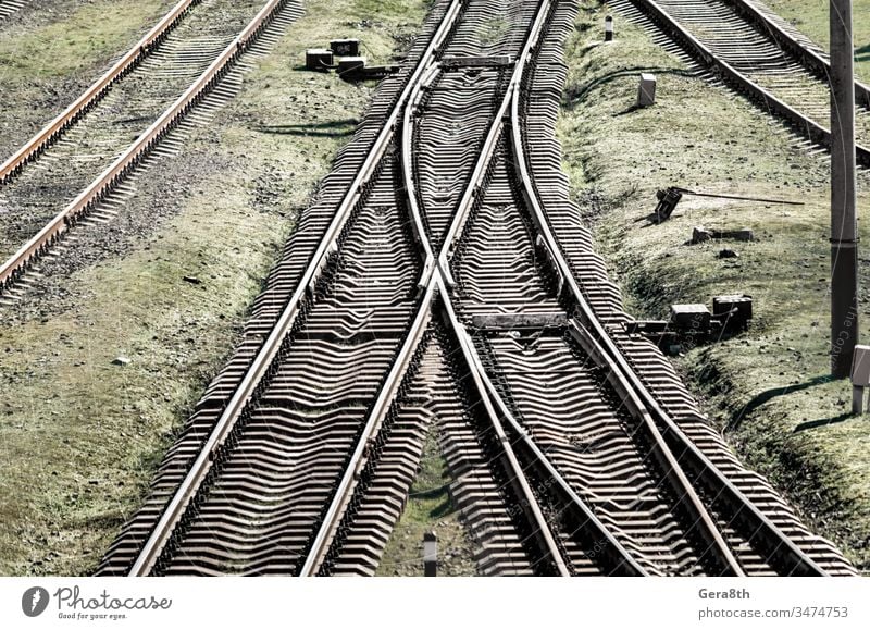 empty old railway in Ukraine colored corruption crisis direction dirty equipment europe grass green grunge industrial industry infrastructure intersection iron