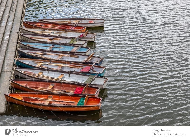 Wooden boats for hire moored on the River Thames activity attraction city colorful colourful day england europe famous kingdom leisure london many nautical old