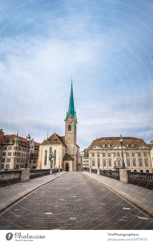 Zurich cityscape with the Munsterbrucke bridge and old buildings Switzerland architecture blue sky church city center clock tower downtown empty street europe
