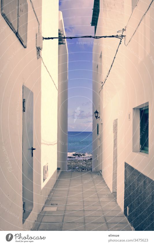 View of the sea through between two houses sea view House (Residential Structure) Narrow Vista Limitation Wall (barrier) Facade Alley Building Built-in Deserted