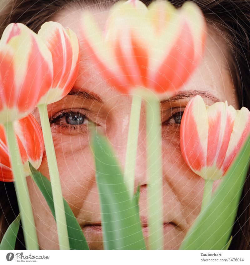 Beautiful woman with tulips smiles in spring Portrait photograph Woman Smiling Spring Joy Joie de vivre (Vitality) Happy Feminine Natural eyes