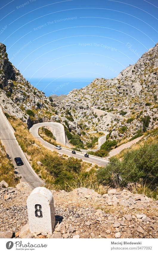 Curvy mountain road on the coast of Mallorca. Spain travel landscape drive journey trip sky sea curve winding steep nature
