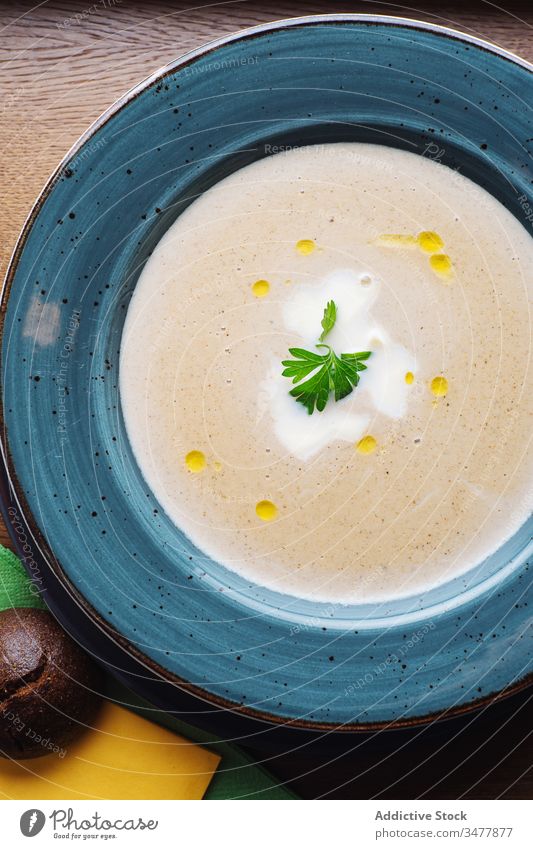 Tasty cream soup with mushrooms porcini puree plate food delicious tasty dish parsley garnish meal dinner gourmet cuisine cook nutrition healthy serve