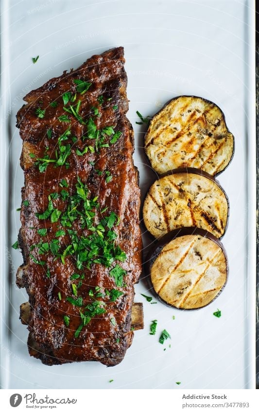 Grilled pork ribs and eggplant meat grill bbq barbecue herb vegetable food delicious tasty dinner dish green natural cook cuisine gourmet appetizing roast serve