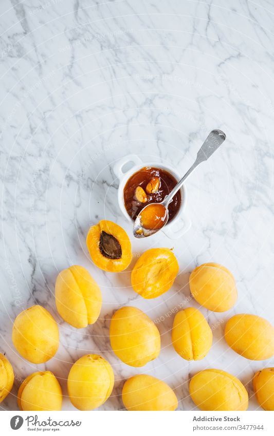 Plate with fresh apricots on white marble table fruit ripe plate yellow orange natural food delicious tasty healthy organic ingredient nutrition meal cuisine