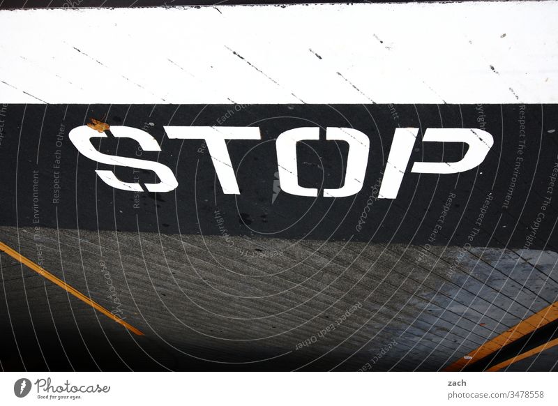 Marking on a road - STOP Letters (alphabet) Wall (building) Facade Sign Wall (barrier) Copy Space bottom lettering Graffiti Characters Copy Space top built
