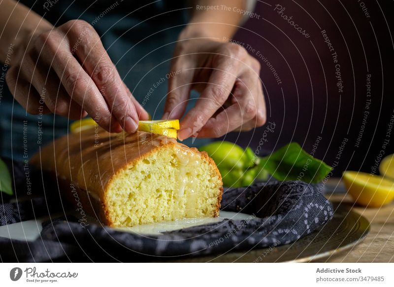 Anonymous person preparing homemade lemon cake pastry baking confectionery dough kitchen gourmet cloth fruit sugar cooking table natural recipe culinary rustic