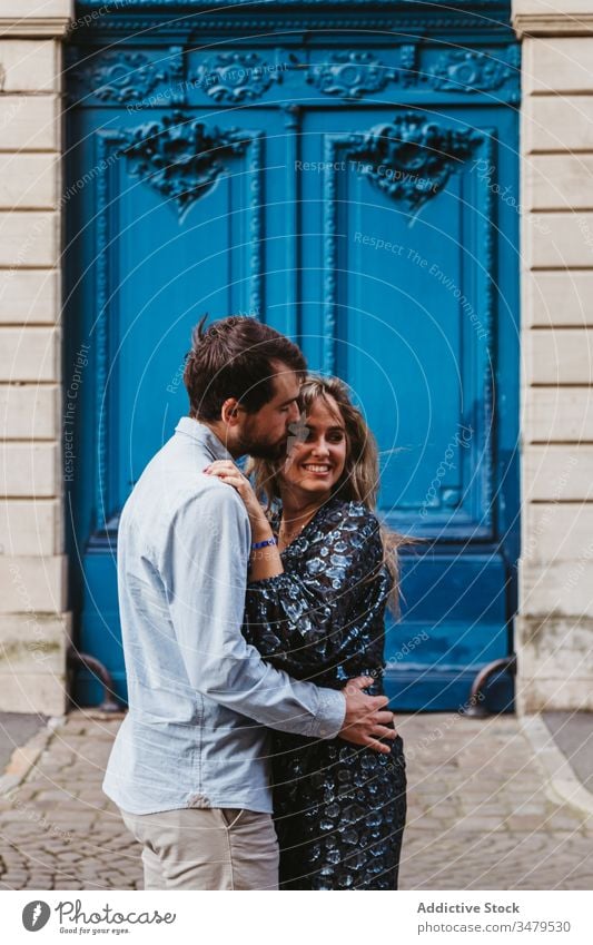 Lovely couple kissing near old building love together relationship embrace happy city historic stone travel romantic boyfriend girlfriend hug date affection