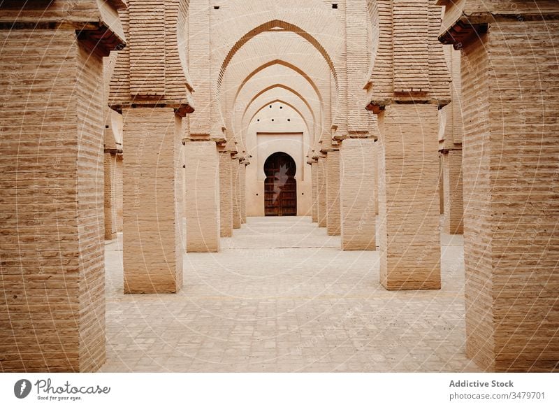 Classic Moroccan gallery with columns and arches architecture ancient old aged stone ornament building morocco door culture historic tradition heritage antique