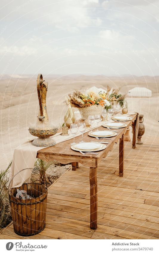Festive table on traditional oriental set decor festive arabic candle flower arrangement morocco plate wooden serve design decoration elegant event dinner