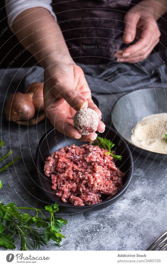 Crop person making meatballs for lunch cook kitchen crumb bread minced show fresh cuisine prepare gourmet dinner food meal ingredient nutrition recipe herb